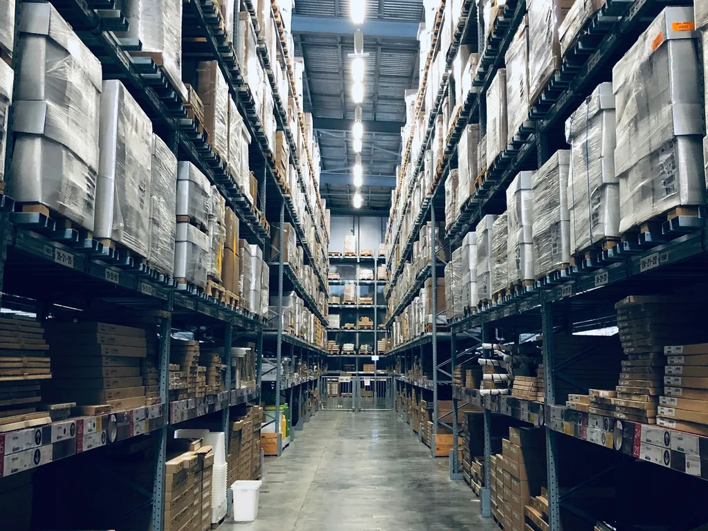 Aisle in a warehouse with full shelves